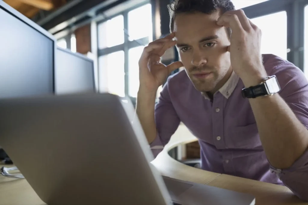 A man with Imposter Syndrome at Work